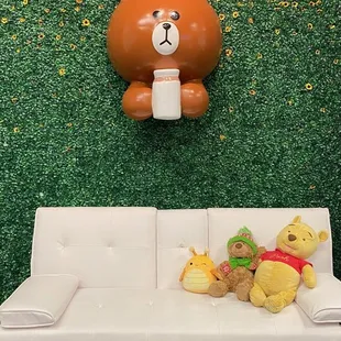 a teddy bear and a sofa