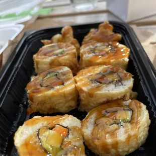 a tray of sushi rolls