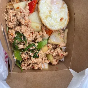 Egg and chicken fried Southeast Asian Steak and Rice Bowl