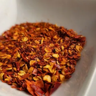 chili flakes in a white bowl