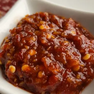 a bowl of chili sauce