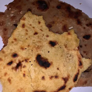 The roti was nasty. It was old from another order. Admit it! The other naan was terribly oily.