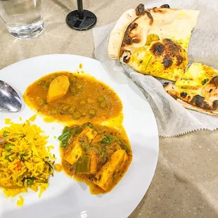 a plate of food and a glass of water