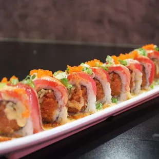 Kaliente sushi roll, 
spicy tuna inside and top with fresh tuna slices