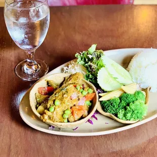 a plate of food and a glass of water