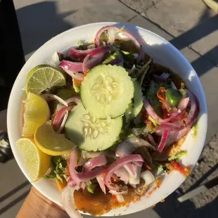 a person holding a plate of food