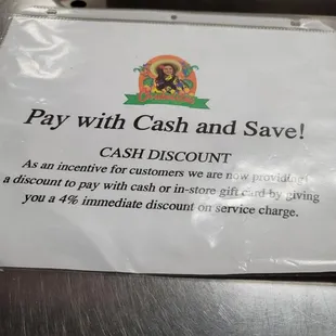 a pay with cash and save sign