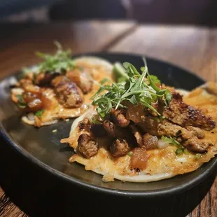 a plate of food on a wooden table