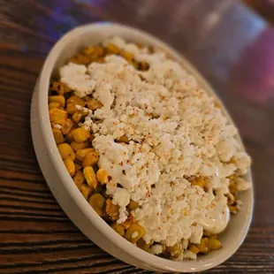 a bowl of rice and corn