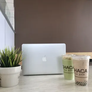 a laptop and a cup of coffee