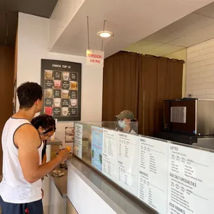 a man standing at the counter