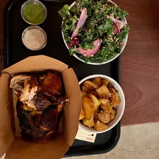 Half chicken, kale salad and potatoes
