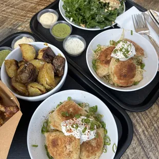 Kale salad, schmaltz potatoes, and perogies