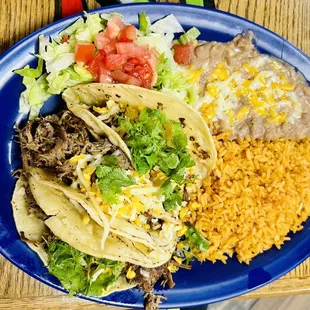 a plate of tacos and rice