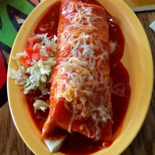 Cha Chi's Burrito Supreme smothered. Get it with brisket filling. Best deal in town.