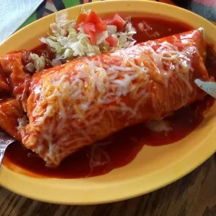 Cha Chi's Burrito Supreme smothered in red chile sauce. Get it with brisket. Great meal in itself at a great price. A+.