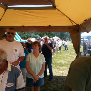 a crowd of people at a bbq