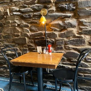 My kind of place: brick wall, colored parquet tiled floors and cozy lighting