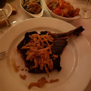 a plate of food and wine glasses