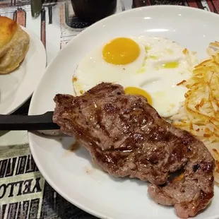 6oz New York strip steak with eggs, hash browns, and biscuits with gravy. $9.99. Excellent.