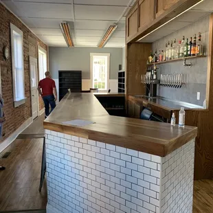 a woman standing at the bar