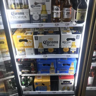 a display of beer in a cooler