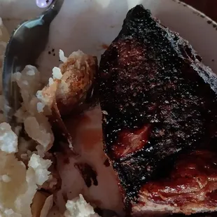 One horribly burnt steak sad sad