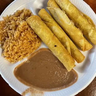 Rolled shredded beef tacos