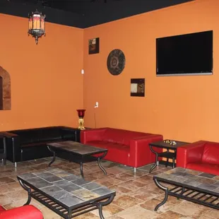 red leather couches and coffee tables