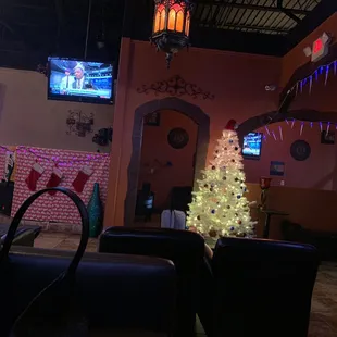 a christmas tree in the lounge area