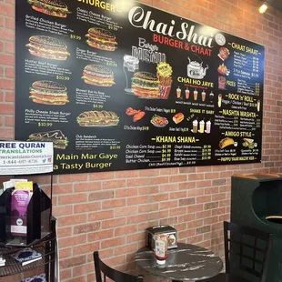 a menu on a brick wall