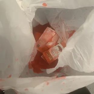 sweet and sour sauce loose and filling the plastic delivery bag.  messy &amp; gross. sriracha packets floating!