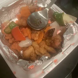 bare sweet &amp; sour chicken. where&apos;s the sauce? oh... the red stuff on the side of the container..