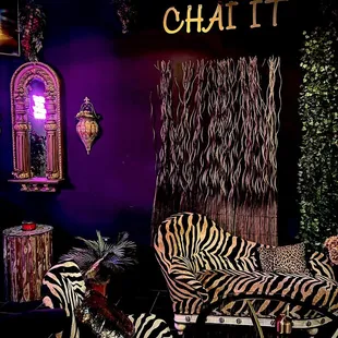 a zebra print couch and chair