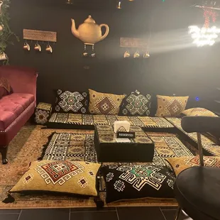 a living room with a couch, coffee table, and rug