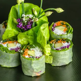 Steamed rice paper filled with basil, cilantro, rice noodles, cucumber, cabbage, and scallions, served with peanut sauce