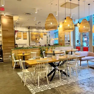 a dining area with tables and chairs