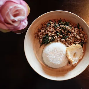 a bowl of rice and meat