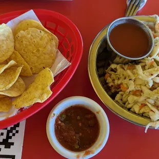 Tortilla Chips with spicy Salsa for the chips.  Plus, curtido and mild salsa for the pupusas.