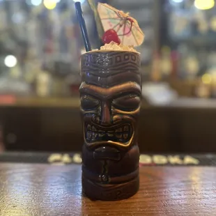 Painkiller: light rum, dark rum, orange juice, pineapple juice, coconut cream, cinnamon on top