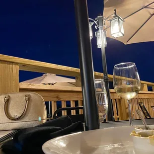 a plate of food and a glass of wine