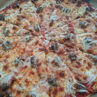 a cheesy pizza in a box