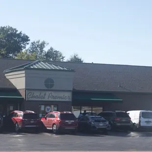 cars parked in front of a building