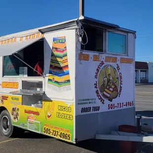a taco truck parked in a parking lot