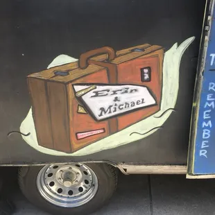 a piece of luggage on the side of a truck