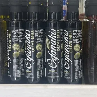a display of olive oil in a grocery store