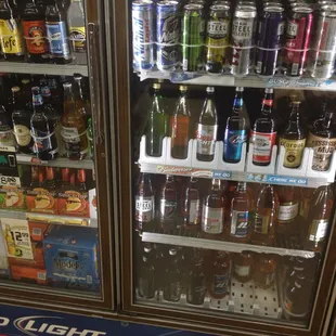 a display of beer in a cooler