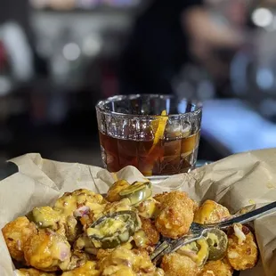 Tap House Tot-chos and Ultimate Old-fashioned Whiskey.  Best in the AV.