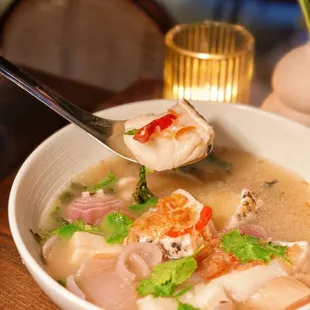 Tom Som Pla  This dish may look ordinary and colorless, the soup had a tangy and delicious taste, but it's hot to handle without !