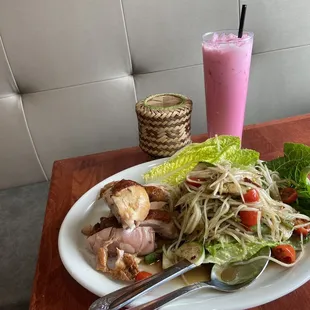 Papaya salad-Laos style, grilled chicken and sticky rice with iced pink milk .